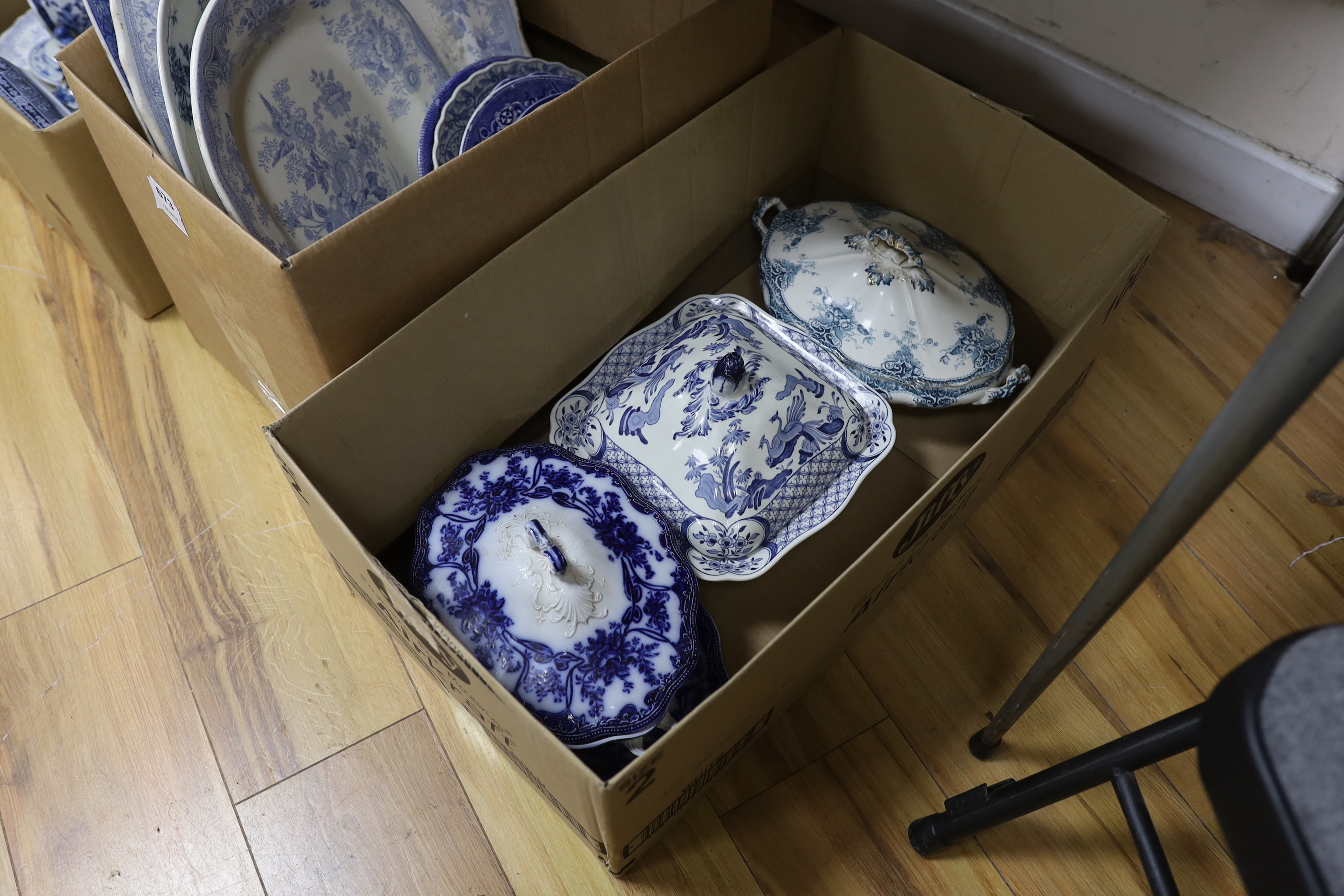 A collection of 19th / 20th century blue and white pottery including platters, tureens and jugs